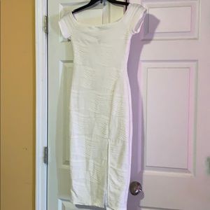 White dress with front split.